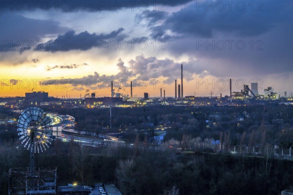 Skyline of the steel location Duisburg, Thyssenkrupp Steel Europe, in Duisburg-Bruckhausen, sunset, industrial scenery, North Rhine-Westphalia, Germany Motorway A42, Emscher Expressway
