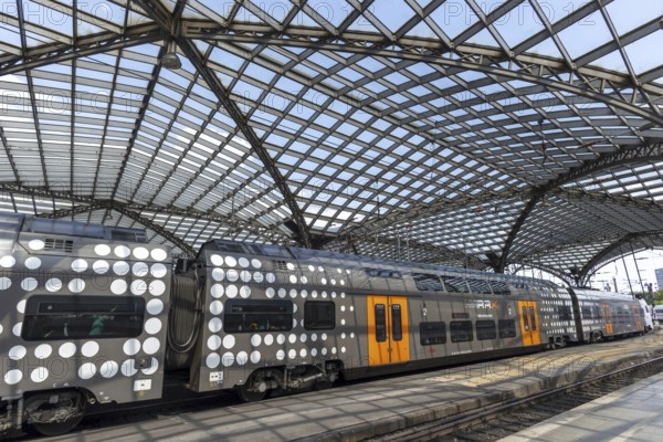 Local train and glass roof at Cologne Central Station, Cologne, Rhineland, North Rhine-Westphalia, Germany, Europe