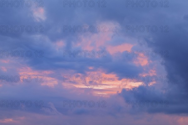 Blue and pink coloured cloudy sky at sunset, Switzerland, Europe