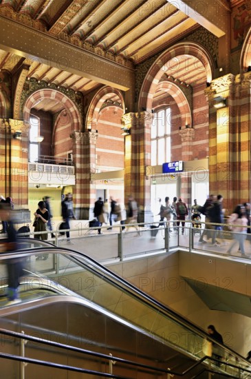Interior view of Centraal Station, Central Station with flag, Amsterdam, Netherlands