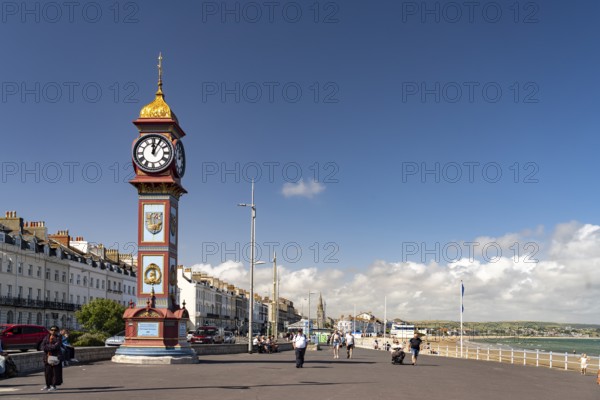 Seafront promenade with the Queen Victorias Jubilee Clock in Weymouth, Dorset, England, Great Britain