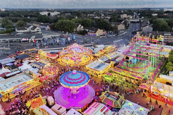 View from above from the Ferris wheel of the Cranger Kirmes in the evening and the district of the same name in Herne, Ruhr area, North Rhine-Westphalia, Germany, Europe