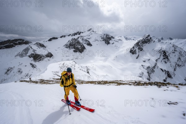 Ski tourers ascending from the Iffigtal to the Wildhornhütte, snow-covered mountain landscape, Bernese Alps, Bernese Oberland, Switzerland, Europe