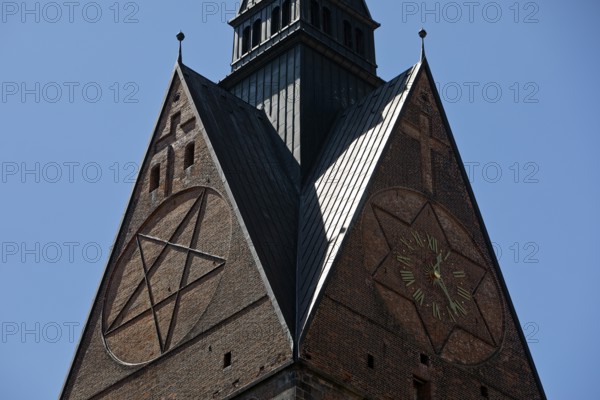 Tower detail of the Marktkirche St. Georgii et Jacobi with hexagram and tower clock, state capital Hannover, Lower Saxony, Germany, Europe