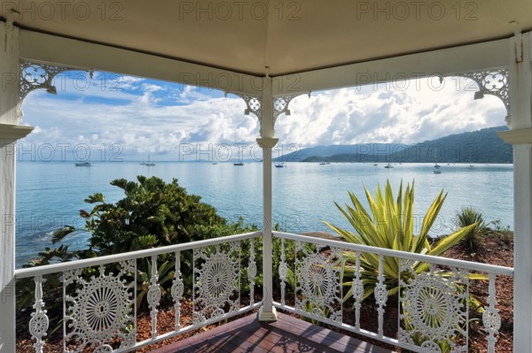 View from the garden pavilion of a hotel to the bay with sailing ships, travel, holiday, sea, Arlie Beach, Queensland, Australia, Oceania