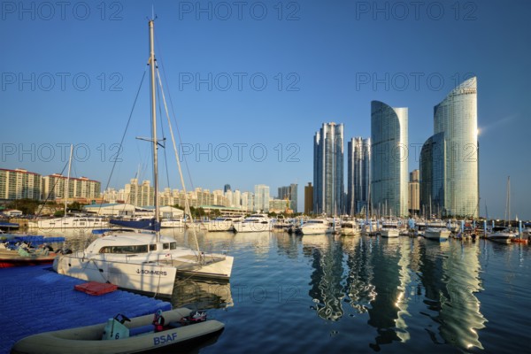 BUSAN, SOUTH KOREA, APRIL 11, 2017: Busan marina with yachts, Marina city skyscrapers with reflection, South Korea, Asia