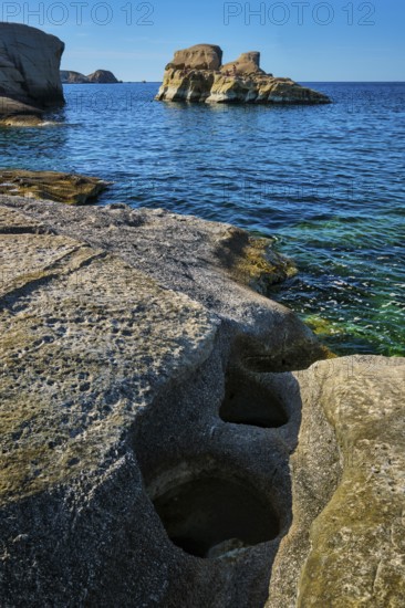 White rocks of famous tourist attraction of Milos island Sarakiniko beach and Aegean sea, Milos island, Reece