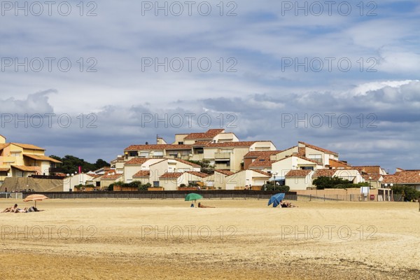 Holiday homes and umbrellas on the beach, Capbreton, Nouvelle-Aquitaine, France, Europe