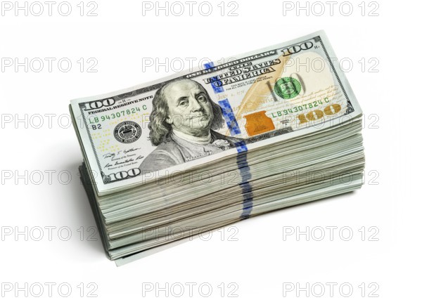 Creative business finance making money concept, stack of bundles of 100 US dollars 2013 edition banknotes bills isolated on white