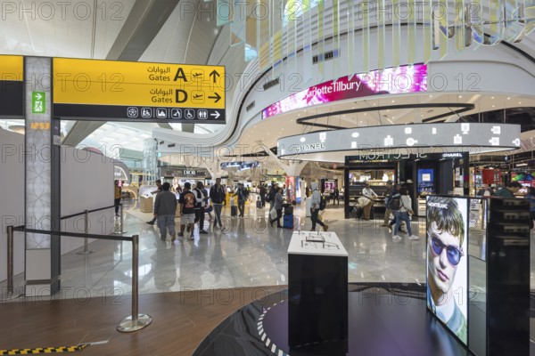 Abu Dhabi Airport, Zayed International Airport with passengers. Duty free shop. The new Terminal A has a capacity of 45 million passengers per year. Modern architecture. Abu Dhabi, United Arab Emirates, UAE, Asia