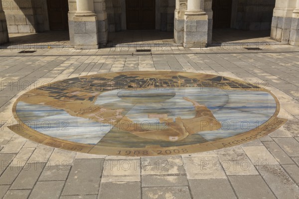 1908-2008 commemorative round marble design with motifs inlaid in paving stones in front of Vittorio Emanuele Theatre building facade, Messina, Sicily, Italy, Europe