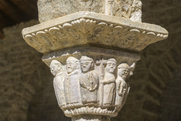 Capital with figures of monks in the cloister of Saint Martin du Canigou Abbey, Casteil, Département Pyrénées-Oriental, France, Europe