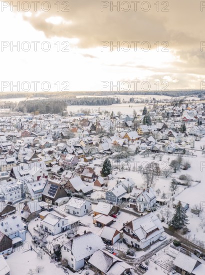 Snowy village with houses, under cloudy sky at sunset, Calw, Altburg, district Calw, Black Forest, Germany, Europe