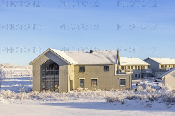 New build residential area with detached houses on a cold snowy winter day in sunshine, Falköping, Sweden, Europe