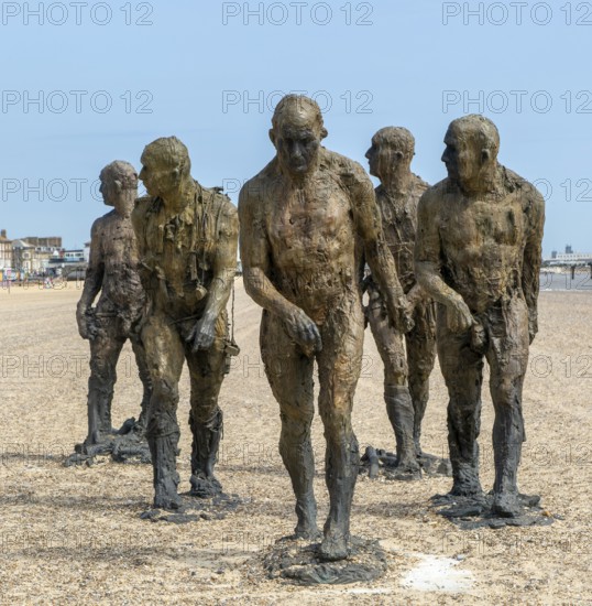 'Walking Men' artwork bronze sculptures by Laurence Edwards, South Beach, Lowestoft, Suffolk, England, UK July 2024