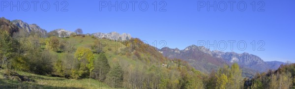 Autumn colours with a view towards the mountain range with Refugio Achille Papa, Piccolo Dolomiti, Recoaro Terme, Province of Vicenza, Italy, Europe