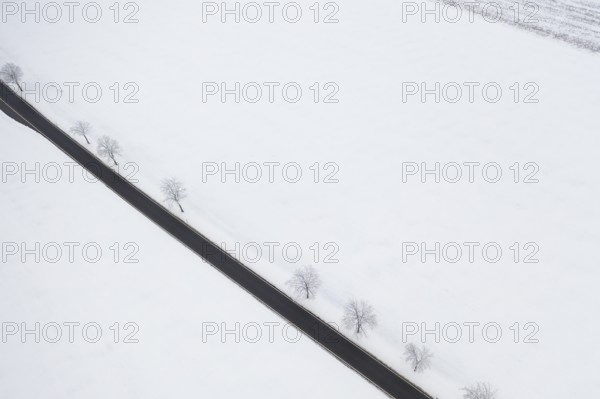 Aerial view of a straight country road in the snow, near Oederan, Saxony, Germany, Europe
