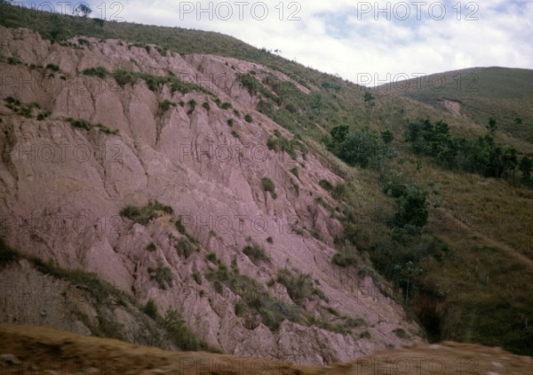 Terra Rossa laterite, red tropical soil, gullies on the slope, location unknown, Brazil 1962