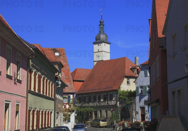 Houses in the centre of the village and the steeple of St John the Baptist Church, Mainbernheim, Lower Franconia, Germany, Europe