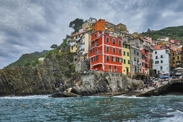 RIOMAGGIORE, ITALY, APRIL 25, 2019: Riomaggiore village popular tourist destination in Cinque Terre National Park a UNESCO World Heritage Site, Liguria, Italy in stormy weather