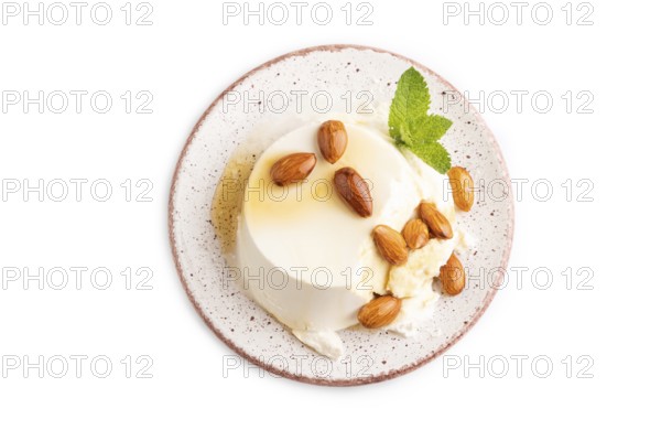 Ricotta cheese with honey and almonds isolated on white background. top view, flat lay, close up
