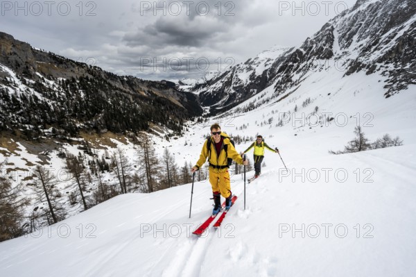 Ski tourers ascending from the Iffigtal to the Wildhornhütte, snow-covered mountain landscape, Bernese Alps, Bernese Oberland, Switzerland, Europe