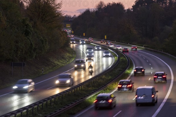 Evening scene on a motorway with heavy traffic, illuminated by headlights under a twilight sky, Rems-Murr district, Baden-Württemberg, Germany, Europe