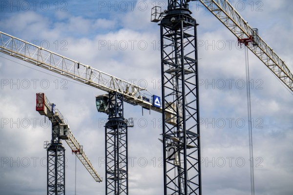 Construction cranes on two large construction sites, construction of office buildings in Dortmund-Schüren-Neu, North Rhine-Westphalia, Germany, Europe
