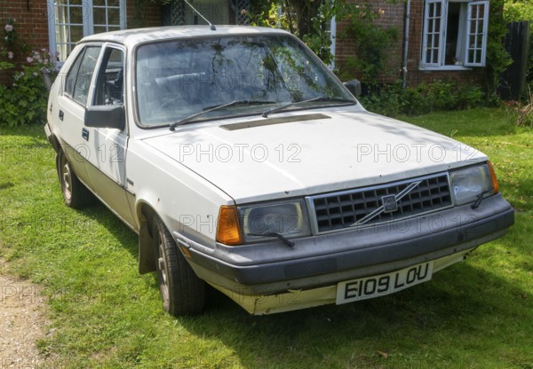 VOLVO 340 DL car from 1987 UK registration plate photographed in 20204