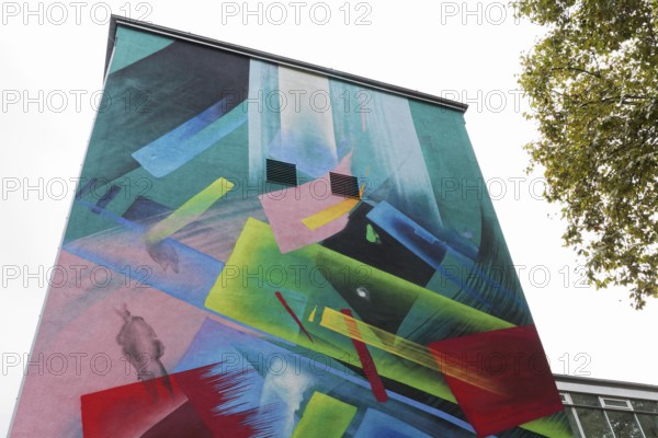 Abstract mural in bright colours on a school building, by graffiti artist Mad C, Düsseldorf, North Rhine-Westphalia, Germany, Europe