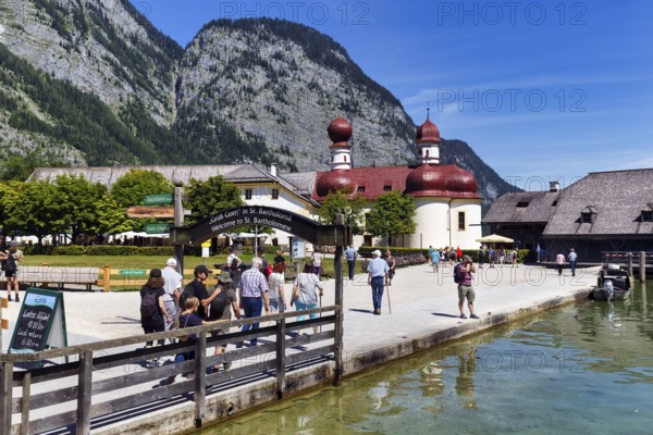 Pilgrimage church St. Bartholomä at Königssee with a group of tourists, Berchtesgaden National Park, Berchtesgadener Land, Upper Bavaria, Bavaria, Germany, Europe