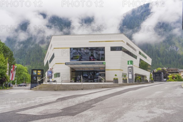 Modern building with large window front in foggy weather in the Alps, Mayrhofen, Zillertal, Austria, Europe