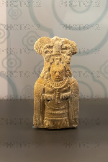 Ceramic figurine model of woman with mantle cloak, from Jaina, Late classical period, Mayan archaeological museum, Fort San Jose, Campeche, Mexico, Central America