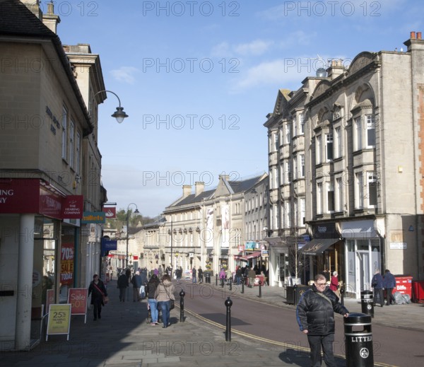 Shops and shoppers in the High Street of the town of Chippenham, Wiltshire, England, United Kingdom, Europe