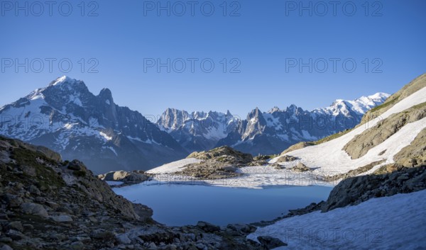 Mountain landscape in the morning light with mountain lake Lac Blanc, mountain peaks Grandes Jorasses, Aiguille du Midi and Mont Blanc, Mont Blanc massif, Aiguilles Rouges, Chamonix-Mont-Blanc, Haute-Savoie, France, Europe