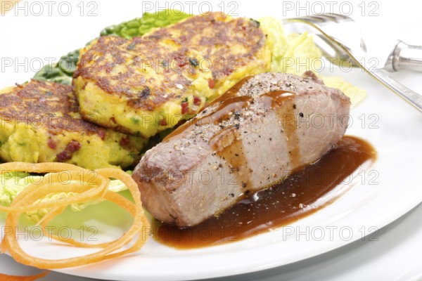 Swabian cuisine, medallions of wild boar with savoy cabbage cakes, meat dish, roasted, hearty, home cooking, typical Swabian, arranged on a plate, traditional cuisine reinterpreted, food photography, studio, Germany, Europe