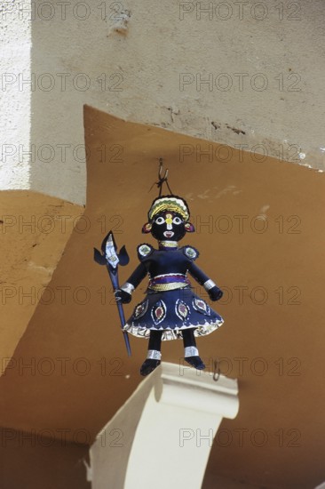 Demon doll outside Dagadusheth Halwai Ganapati Temple, Pune, Maharashtra, India, Asia