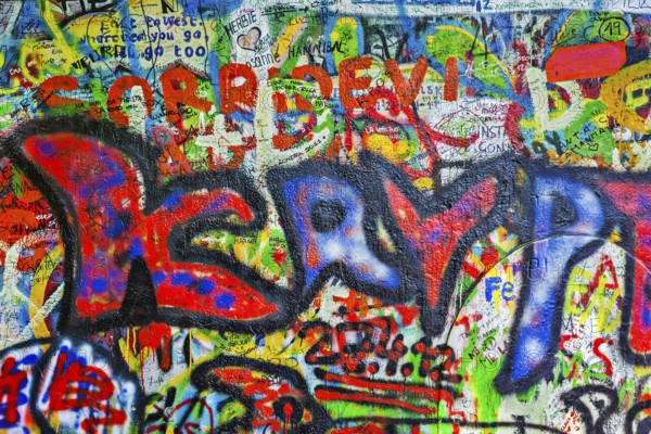 PRAGUE, CZECH REPUBLIC, APRIL 28, 2012: Lennon Wall is filled with John Lennon-inspired graffiti and pieces of lyrics from Beatles songs