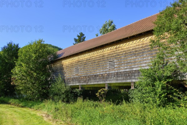 The covered wooden bridge Beuron is a historic bridge over the Danube near the Benedictine monastery of Beuron in the Upper Danube Valley, Baden-Württemberg, Germany, Europe