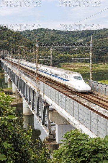 Shinkansen type N700 high-speed train of Japan Rail JR train on the Sanyo Shinkansen line in Kurashiki, Japan, Asia