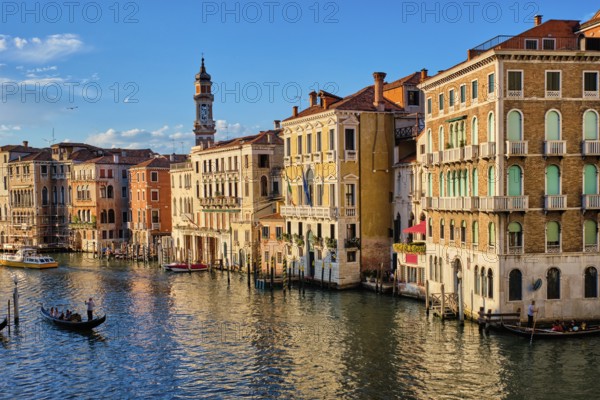 VENICE, ITALY, JUNE 27, 2018: Grand Canal with boats and gondolas on sunset, Venice, Italy, Europe