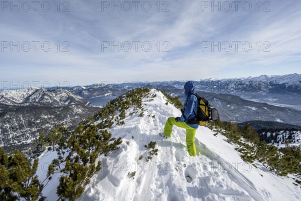 Ski tourer at the summit of Simetsberg, mountain panorama, Estergebirge, Bavarian Prealps, Bavaria Germany