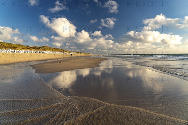 Clouds reflected in the water on the west beach near Westerland, island of Sylt, district of North Friesland, Schleswig-Holstein, Germany, Europe