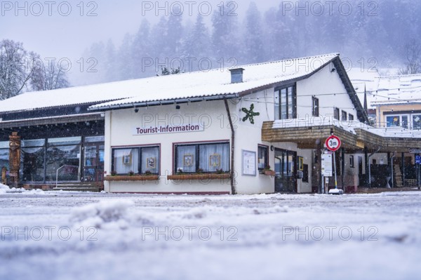 Tourist information centre surrounded by snow-covered hills and forests in winter, Enzklösterle, district of Calw, Black Forest, Germany, Europe