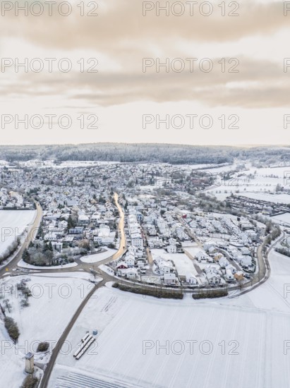Snow-covered small village surrounded by open fields, Calw- Stammheim, Black Forest, Germany, Europe