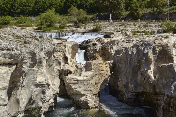 The cascades of Sautadet with limestone cliffs and the river Cèze in La Roque-sur-Cèze, Département Gard, Occitanie region, France, Europe