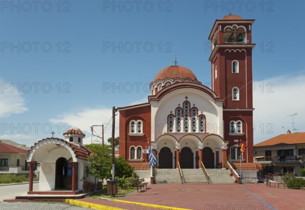 A Greek Orthodox church with a red roof and bell tower under a clear blue sky, Church of St Nicholas, Ierissos, Sithonia, Halkidiki, Central Macedonia, Greece, Europe