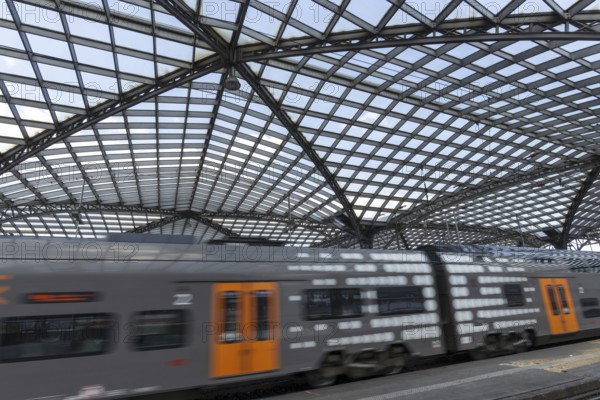 Local train and glass roof at Cologne Central Station, Cologne, Rhineland, North Rhine-Westphalia, Germany, Europe