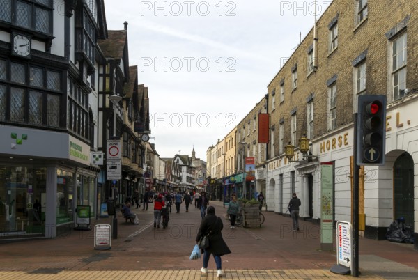 People shoppers walking along pedestrianised town centre street, Tavern Street, Ipswich, Suffolk, England, UK