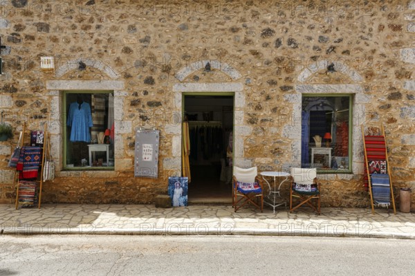 Façade with souvenir shop, typical stone house in Stoupa, former fishing village, Mani, Greece, Europe